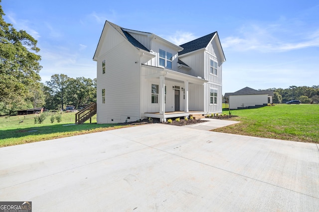 view of front of home with a front lawn and a porch