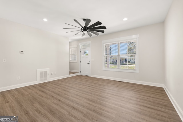 unfurnished room featuring ceiling fan and wood-type flooring