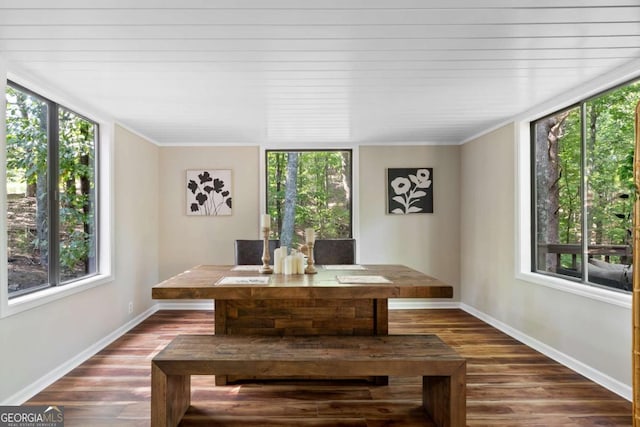 unfurnished dining area featuring hardwood / wood-style floors