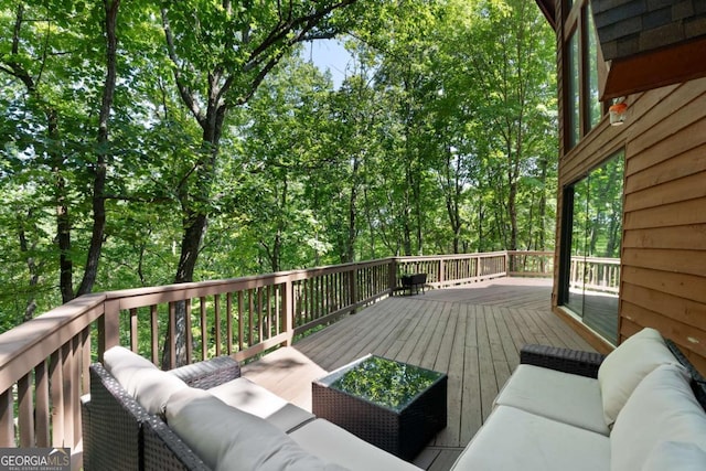 wooden deck featuring outdoor lounge area