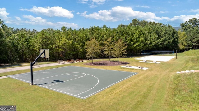 view of sport court featuring a yard and volleyball court