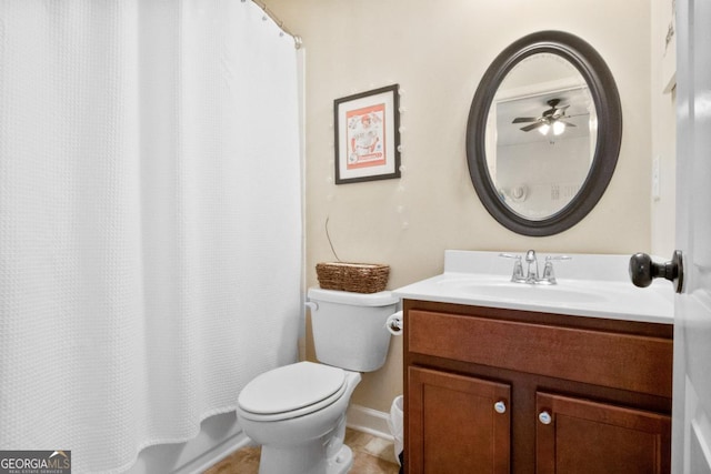 full bathroom featuring shower / tub combo with curtain, vanity, and toilet