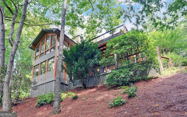 view of home's exterior featuring a sunroom