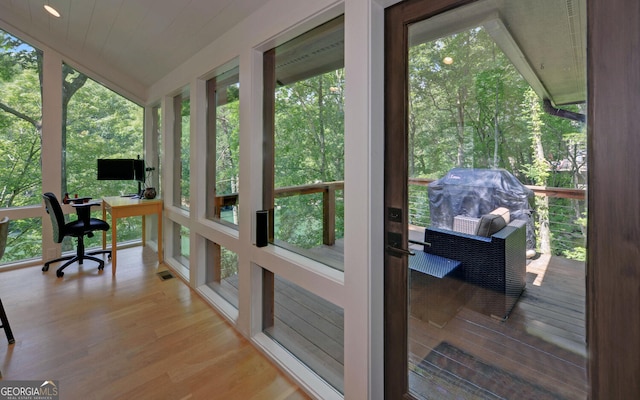 sunroom / solarium featuring a healthy amount of sunlight