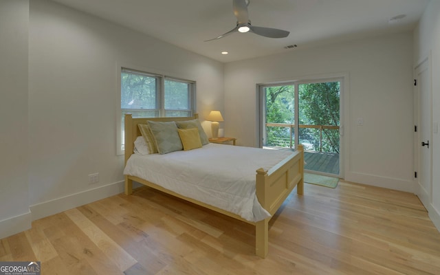 bedroom with ceiling fan, light hardwood / wood-style flooring, and access to outside