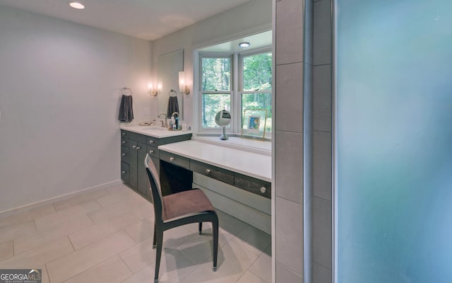 office area featuring light tile patterned floors and sink