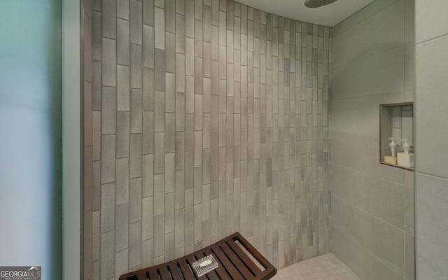 bathroom with tiled shower