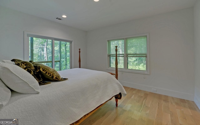 bedroom with light hardwood / wood-style floors