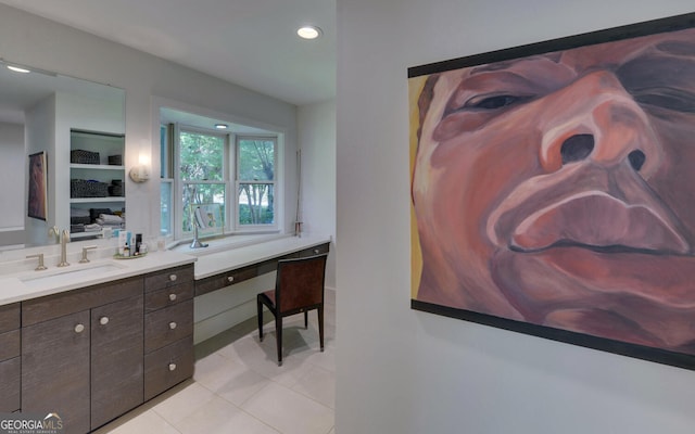 bathroom featuring vanity, built in features, and tile patterned floors