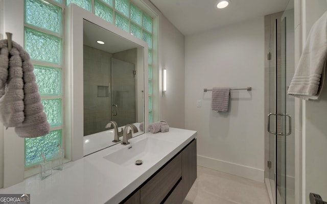 bathroom with vanity, tile patterned floors, and walk in shower