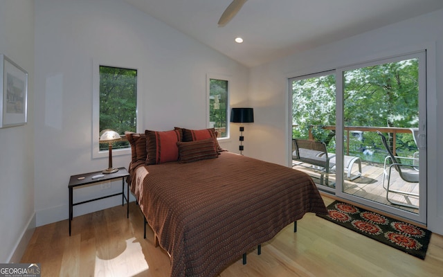 bedroom featuring lofted ceiling, hardwood / wood-style floors, access to exterior, and ceiling fan