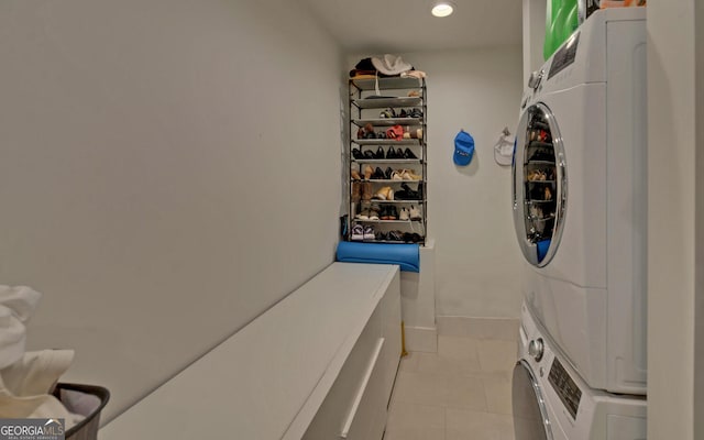 laundry room with stacked washer / drying machine