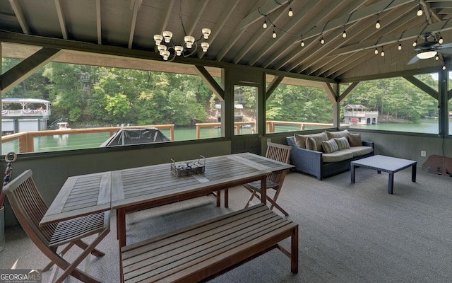 view of patio / terrace with a water view, ceiling fan, and outdoor lounge area