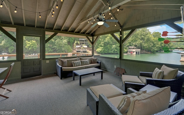 view of patio / terrace with outdoor lounge area, ceiling fan, and a water view