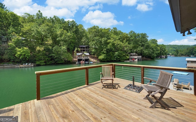 dock area featuring a deck with water view