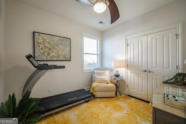 workout area featuring ceiling fan