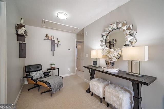 living area with light colored carpet