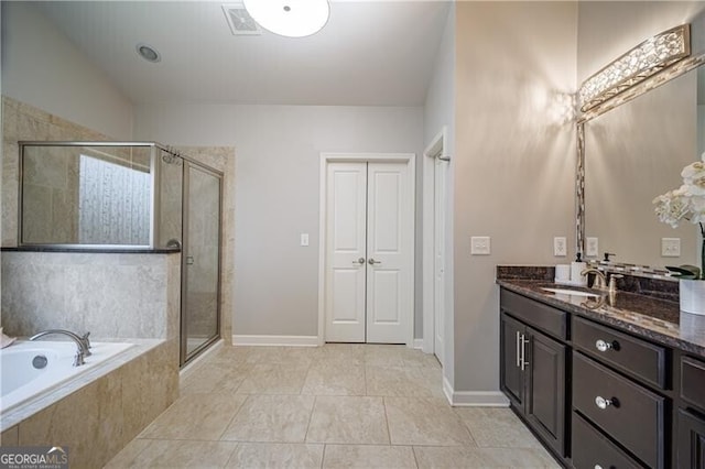 bathroom featuring vanity, tile patterned floors, and shower with separate bathtub