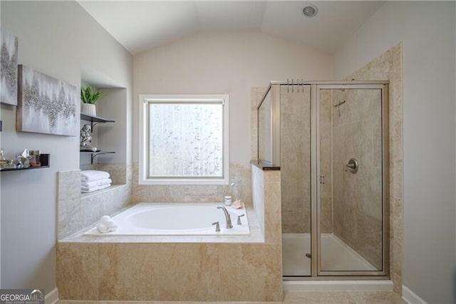 bathroom featuring lofted ceiling and plus walk in shower