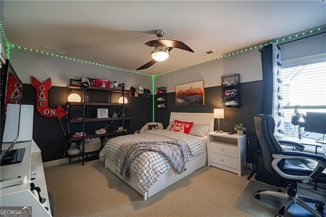 carpeted bedroom featuring ceiling fan