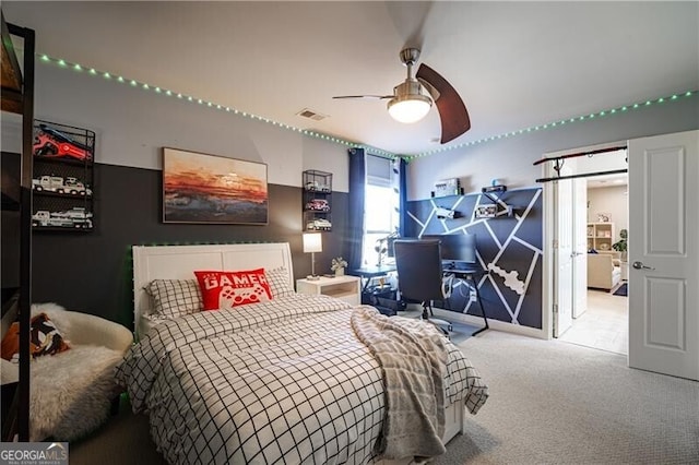 carpeted bedroom with ceiling fan