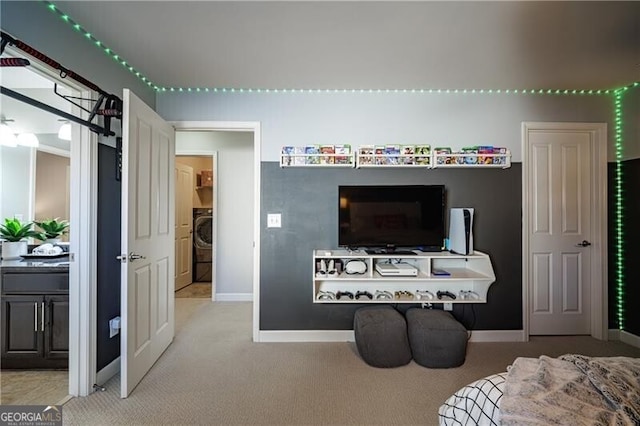 living room featuring light colored carpet and washer / clothes dryer