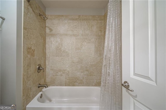 bathroom featuring shower / bathtub combination with curtain