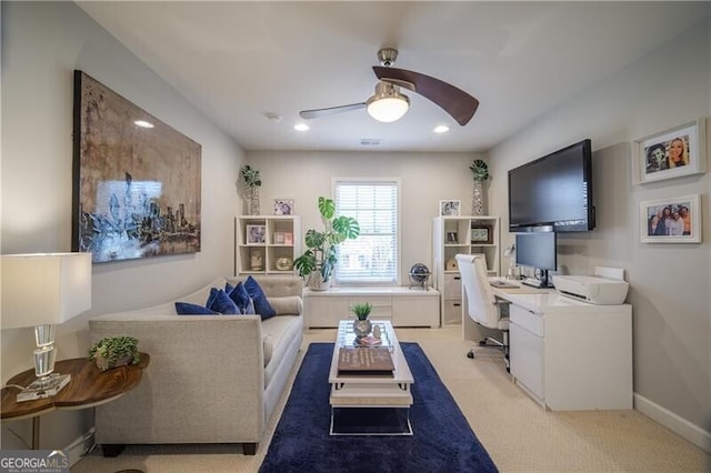 carpeted home office with ceiling fan