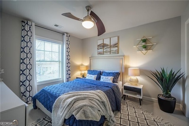 carpeted bedroom featuring ceiling fan