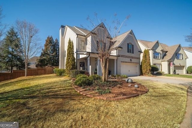 view of front of property with a garage and a front yard