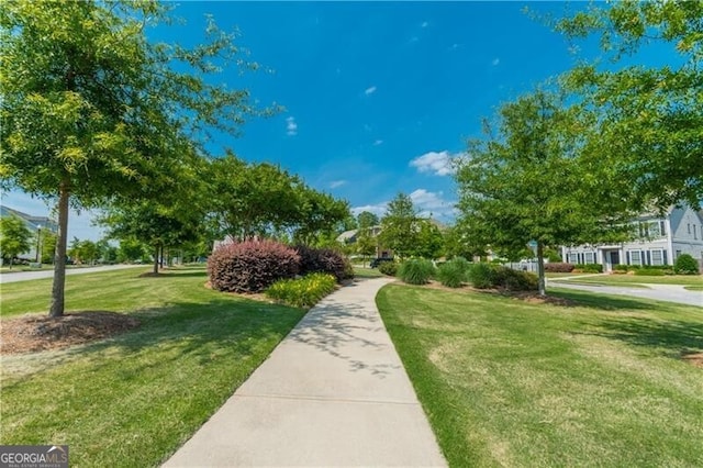 view of home's community featuring a lawn