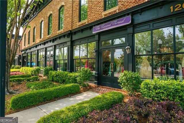 view of exterior entry featuring french doors