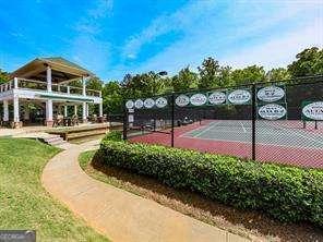 view of community with tennis court