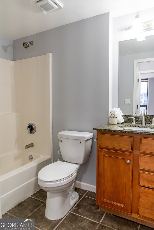 full bathroom with shower / bath combination, vanity, tile patterned flooring, and toilet