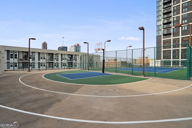 view of basketball court featuring tennis court