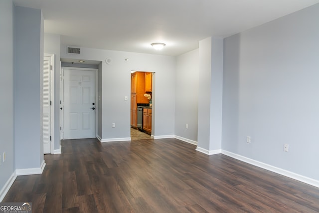 unfurnished room with dark hardwood / wood-style floors