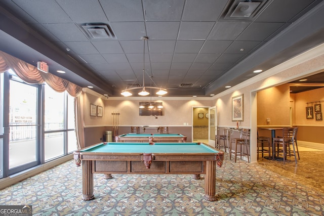 playroom with ornamental molding, a tray ceiling, a drop ceiling, and billiards