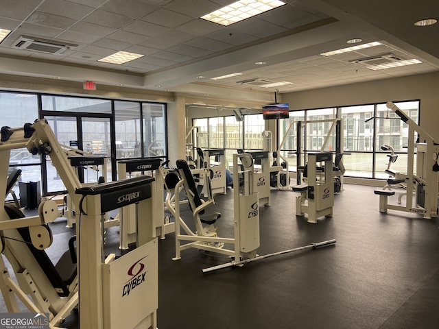 exercise room featuring a drop ceiling