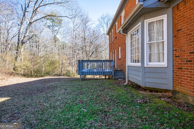 view of yard with a wooden deck