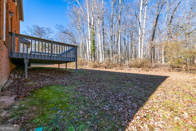 view of yard featuring a wooden deck