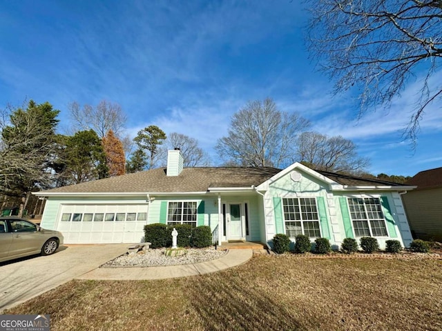 ranch-style house featuring a garage and a front yard