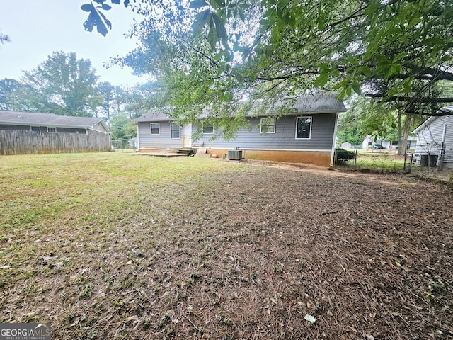 view of yard with central air condition unit