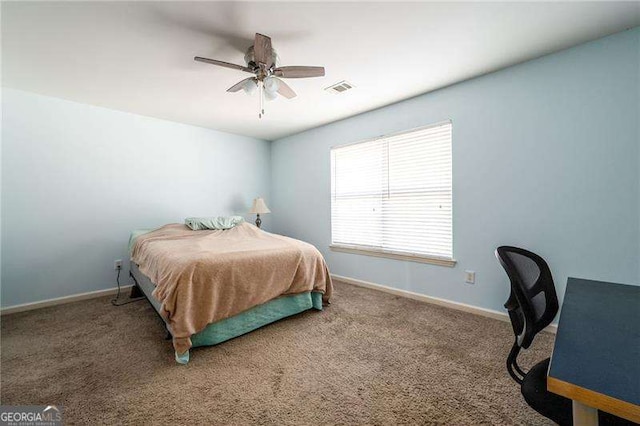 bedroom featuring ceiling fan and carpet