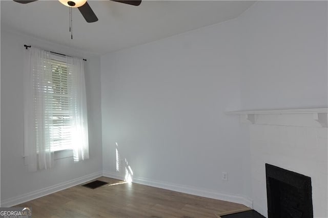 unfurnished living room with hardwood / wood-style floors and ceiling fan