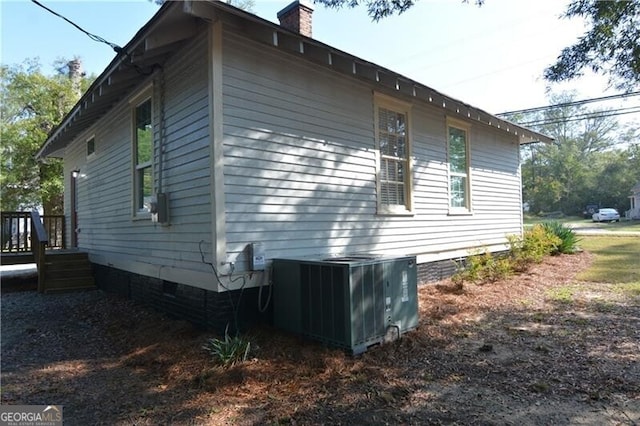 view of side of property featuring cooling unit