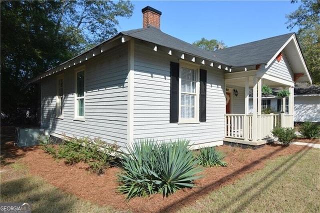 view of side of home featuring a lawn