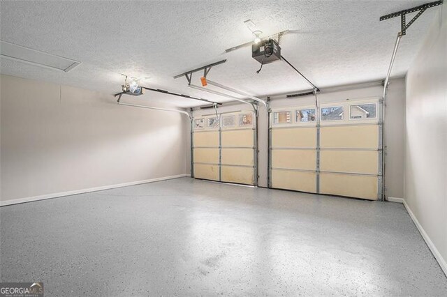 snow covered property featuring central AC unit and a garage