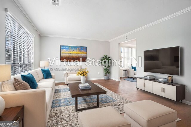 spare room featuring dark hardwood / wood-style flooring, ornamental molding, and a textured ceiling