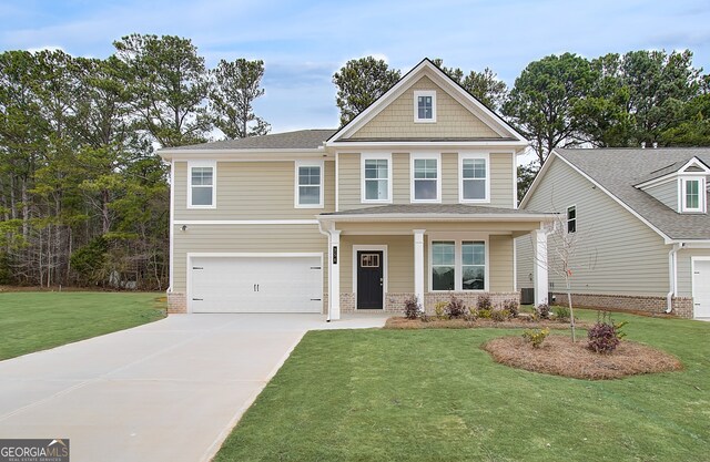 view of front facade with a garage, a front yard, and central AC unit