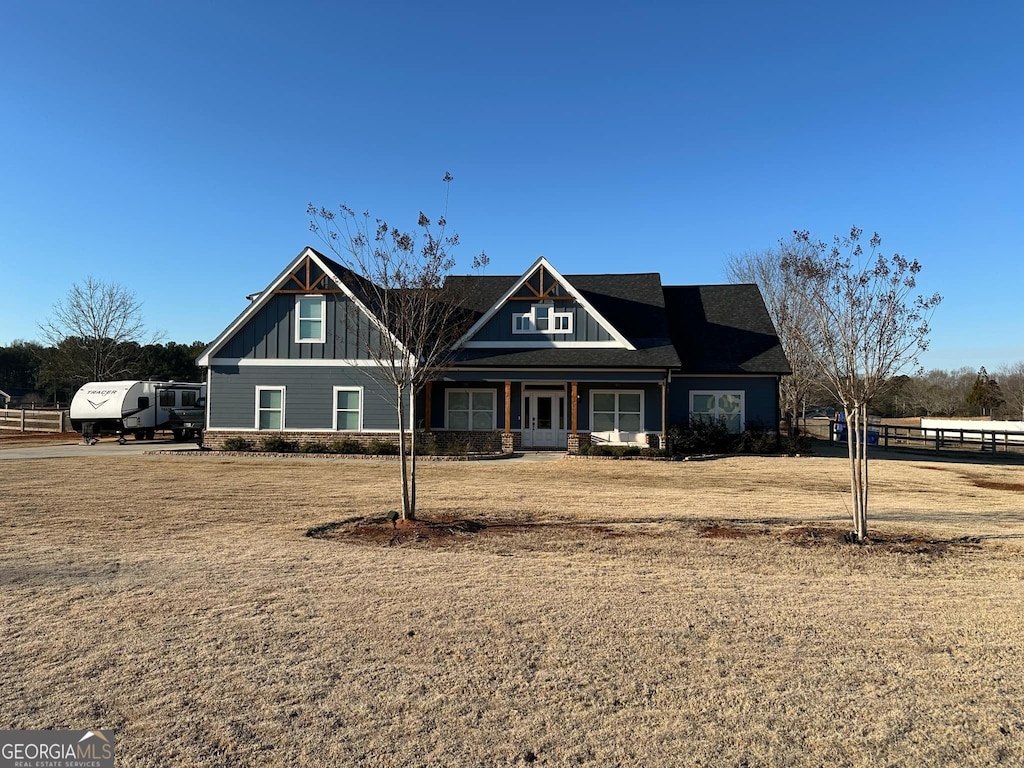 craftsman inspired home with a front yard